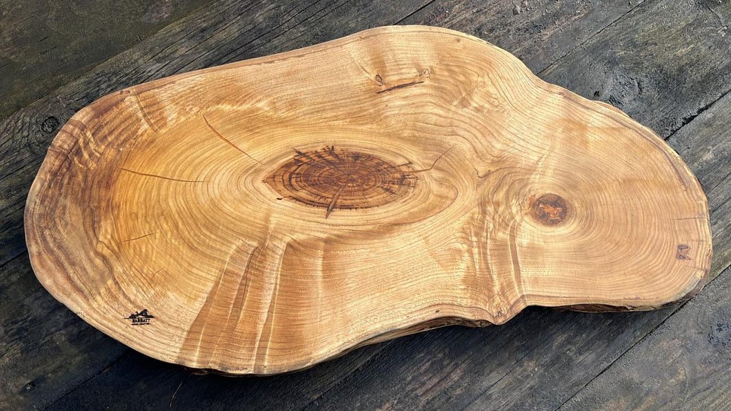 London plane serving board with orange highlights