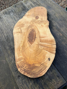 London plane serving board with orange highlights